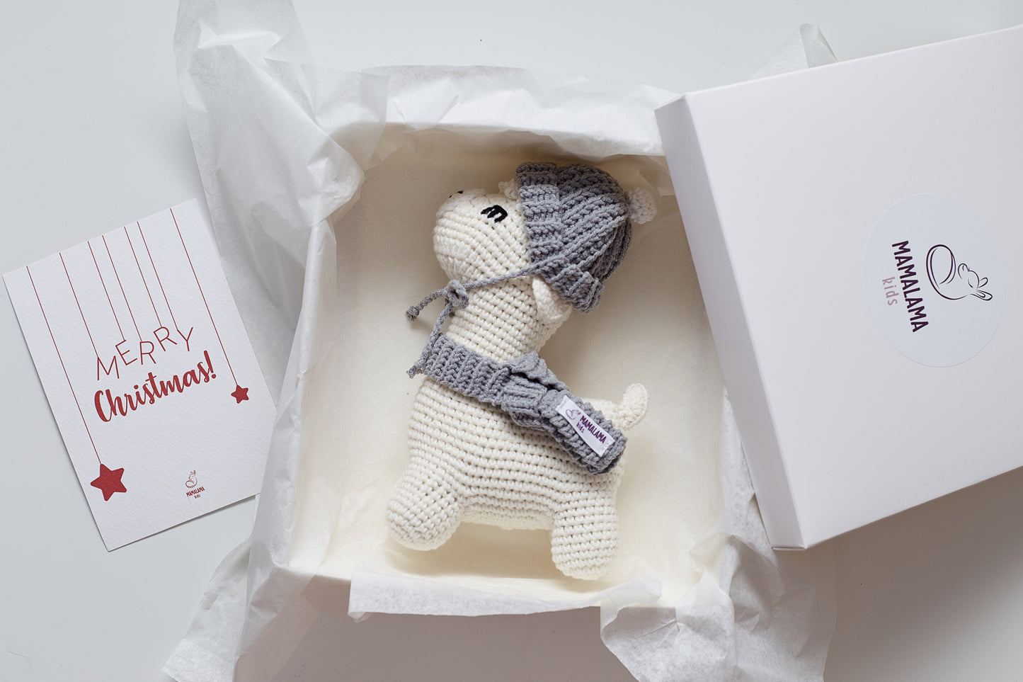 Christmas llama in a gray hat toy gift box Off white