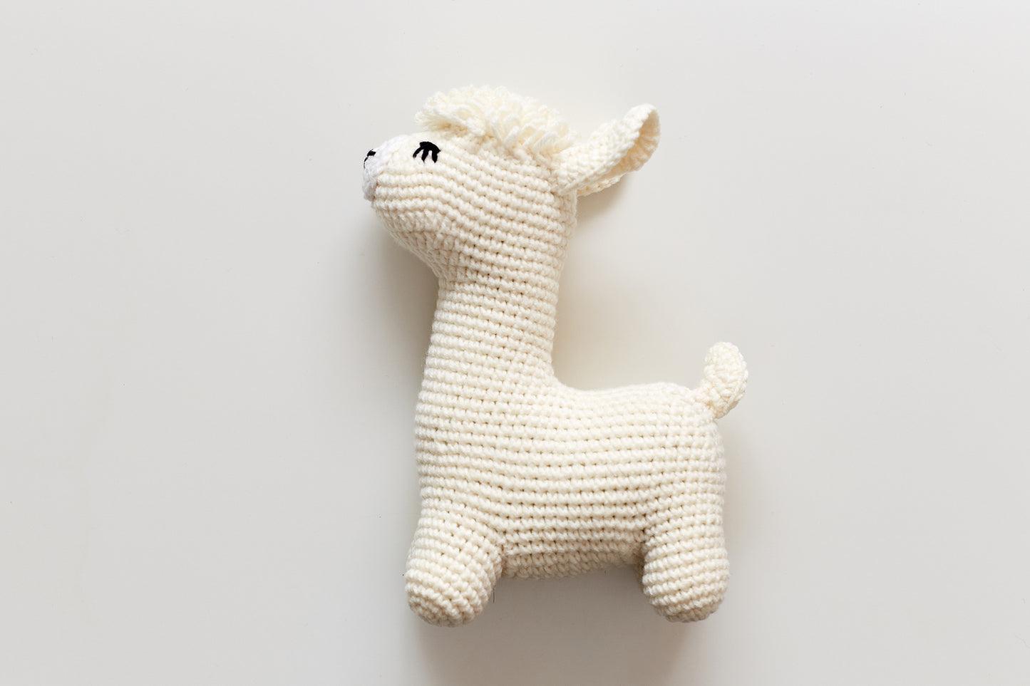 Christmas llama in a gray hat toy gift box Off white